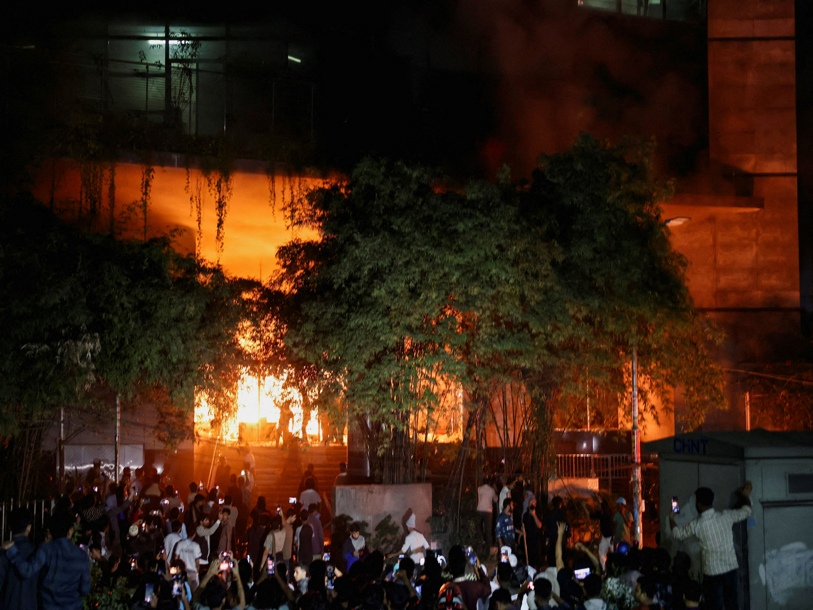 A group of people set fire to The Daily Star newspaper office building, following the death of Sharif Osman Hadi, a student leader (Photo/Reuters)