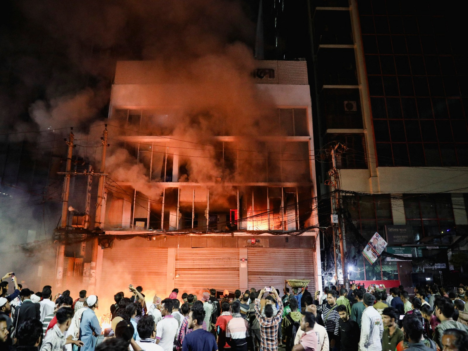 A group of people set fire to The Daily Star newspaper office building, following the death of Sharif Osman Hadi, a student leader (Photo/Reuters)