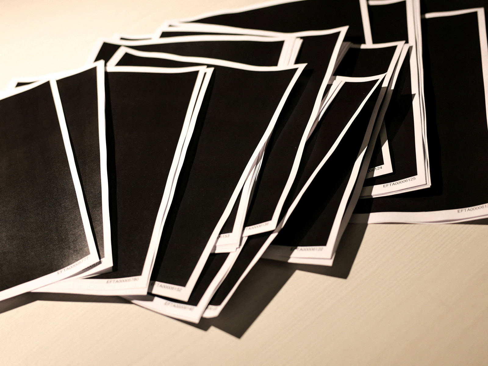 Newly-released documents from disgraced late financier and sex offender Jeffrey Epstein, including a sheaf of entirely redacted pages, are seen in this handouts released by the US Justice Department (Photo/Reuters)