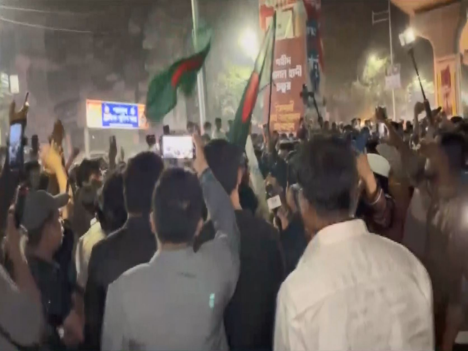 Protesters block roads and chant slogans at the Shahbagh intersection in Dhaka on Friday (Photo/ANI)