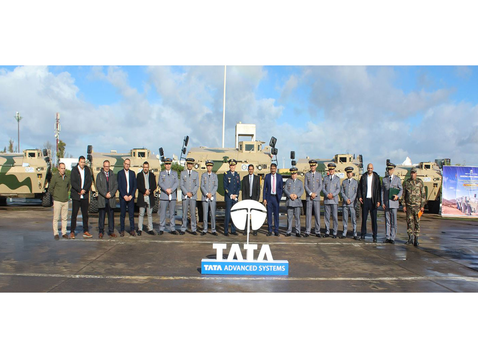 Officials pose with WhAP 8x8 armoured vehicles during the handover of the first lot to the Royal Moroccan Army by Tata Advanced Systems Limited in Morocco. (Photo: X/@tataadvanced)