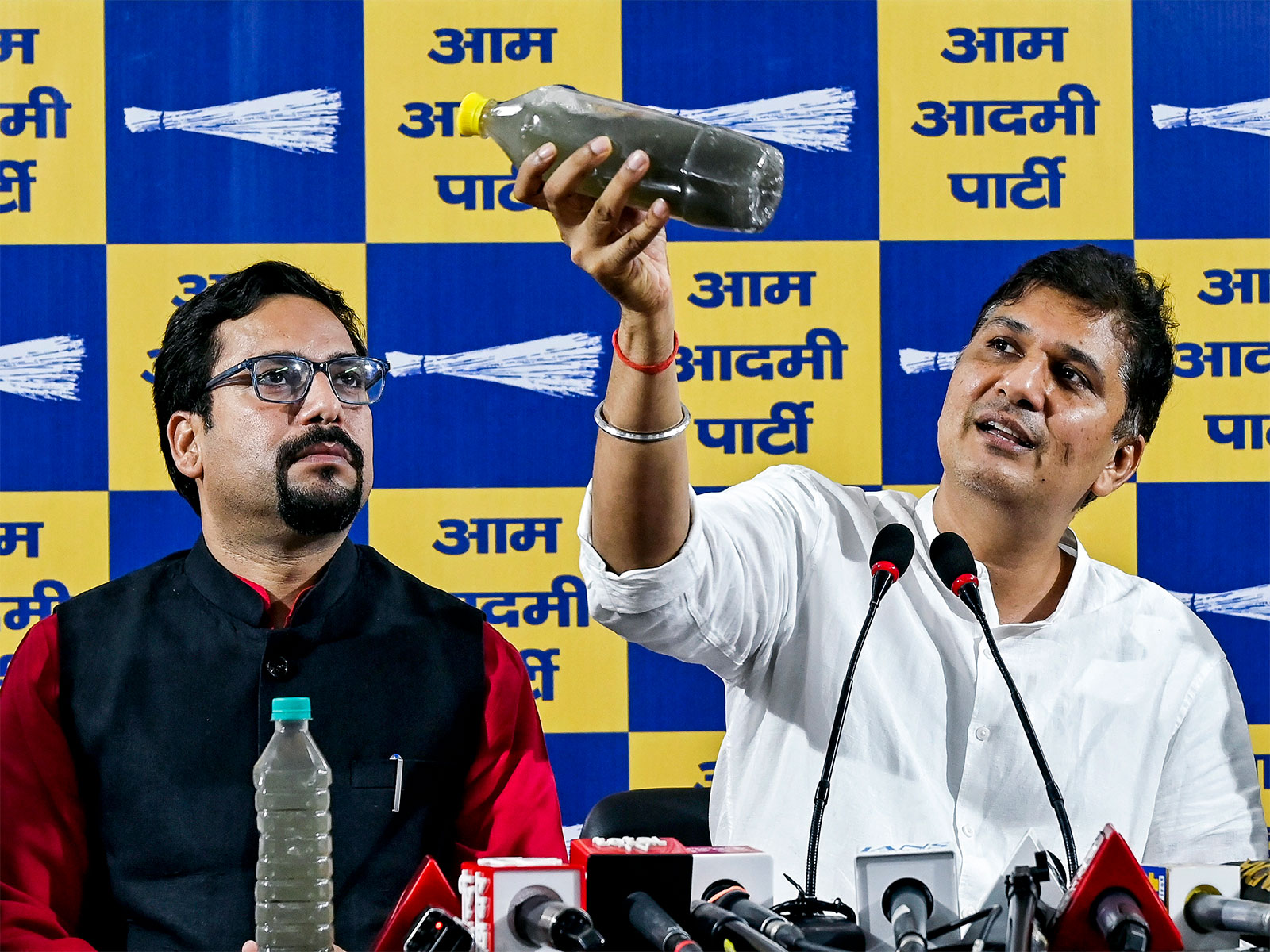 AAP leader Saurabh Bhardwaj with AAP MLA Sanjeev Jha. (Photo/ANI)