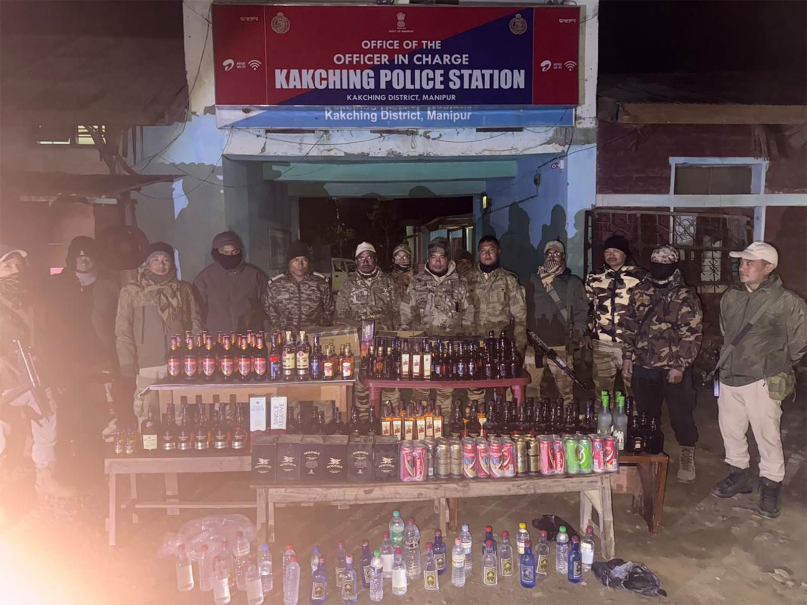Police with the seized liquor at the Kakching Police Station in Manipur (Photo/Manipur Police)
