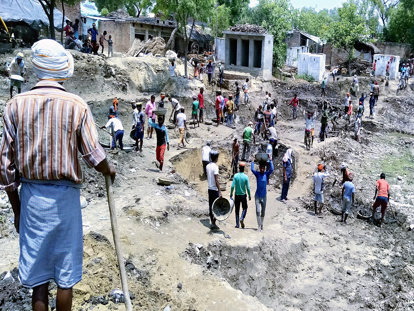 Laborers busy in digging work of a pond under MGNREGA. (File Photo/ANI) 