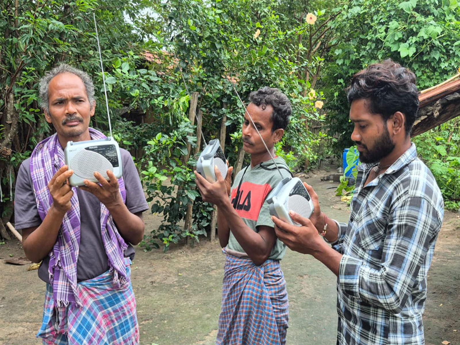 Locals gets radios under Civic Action Programme in Bastar division. (Photo/ANI)