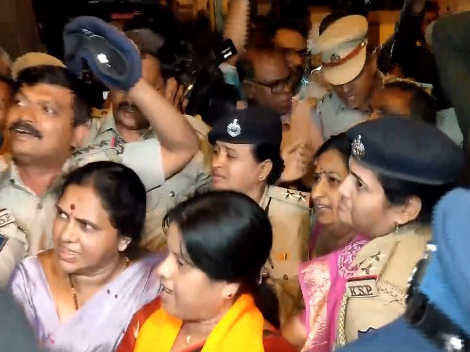 Police detaining BJP workers during protest over alleged assault of woman party worker (Photo/ANI)
