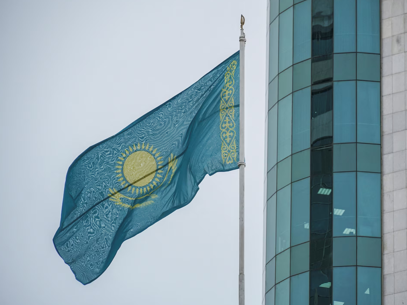 Kazakhstan’s national flag flies outside the Mazhilis, the lower house of Parliament, in Astana, Kazakhstan. (Photo/Reuters)