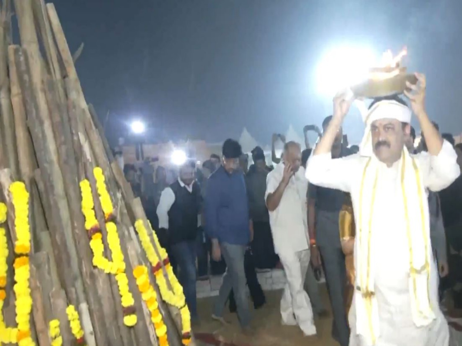 Former BJP MP GVL Narasimha Rao performing traditional rituals on the occassion of Bhogi Pongal at Andhra University grounds in Visakhapatnam (Photo/ANI)