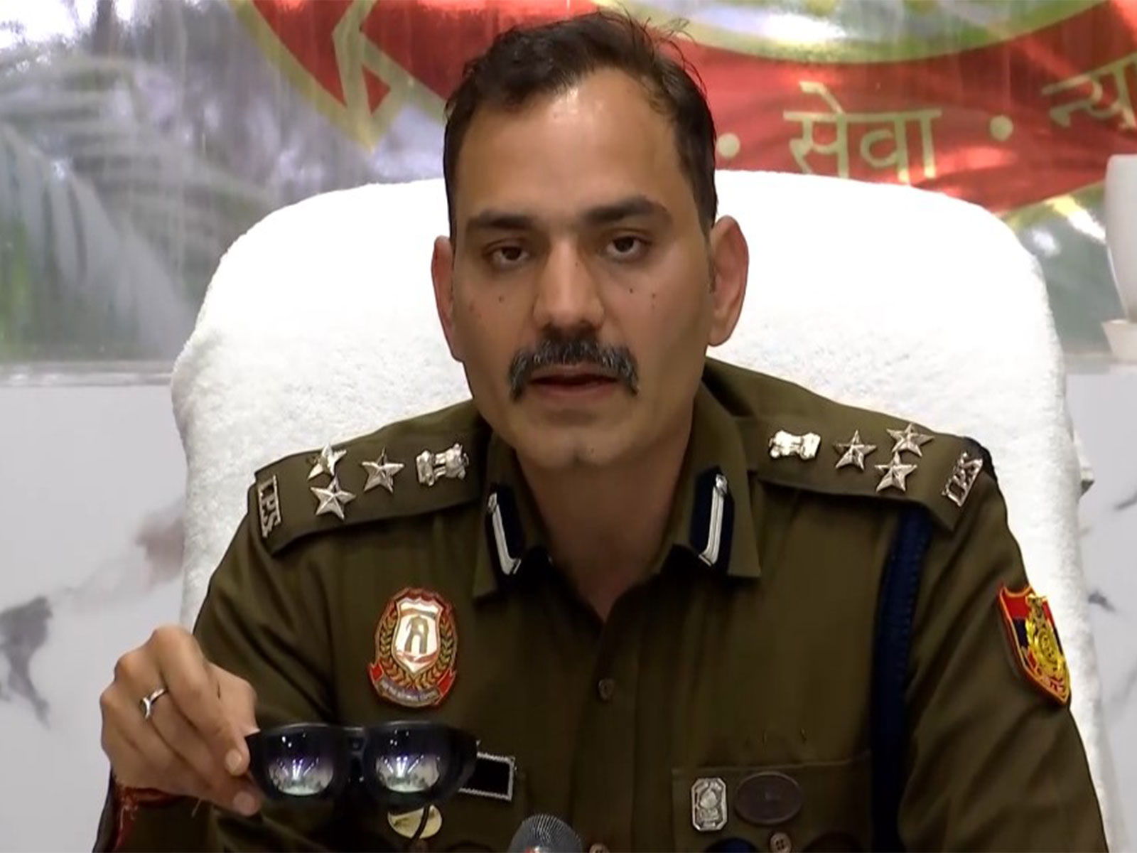 Additional CP Devesh Kumar Mahala shows AI-enabled smart glass at press conference in Delhi (Photo/ ANI)