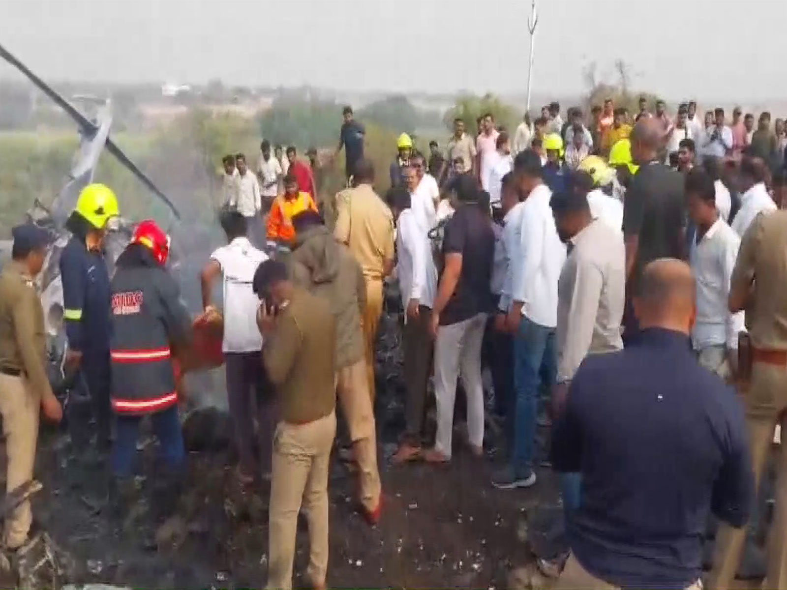 Visuals from the crash spot show fire and smoke spewing from the remains of the plane near Baramati airport in Maharashtra. (Photo/ANI)