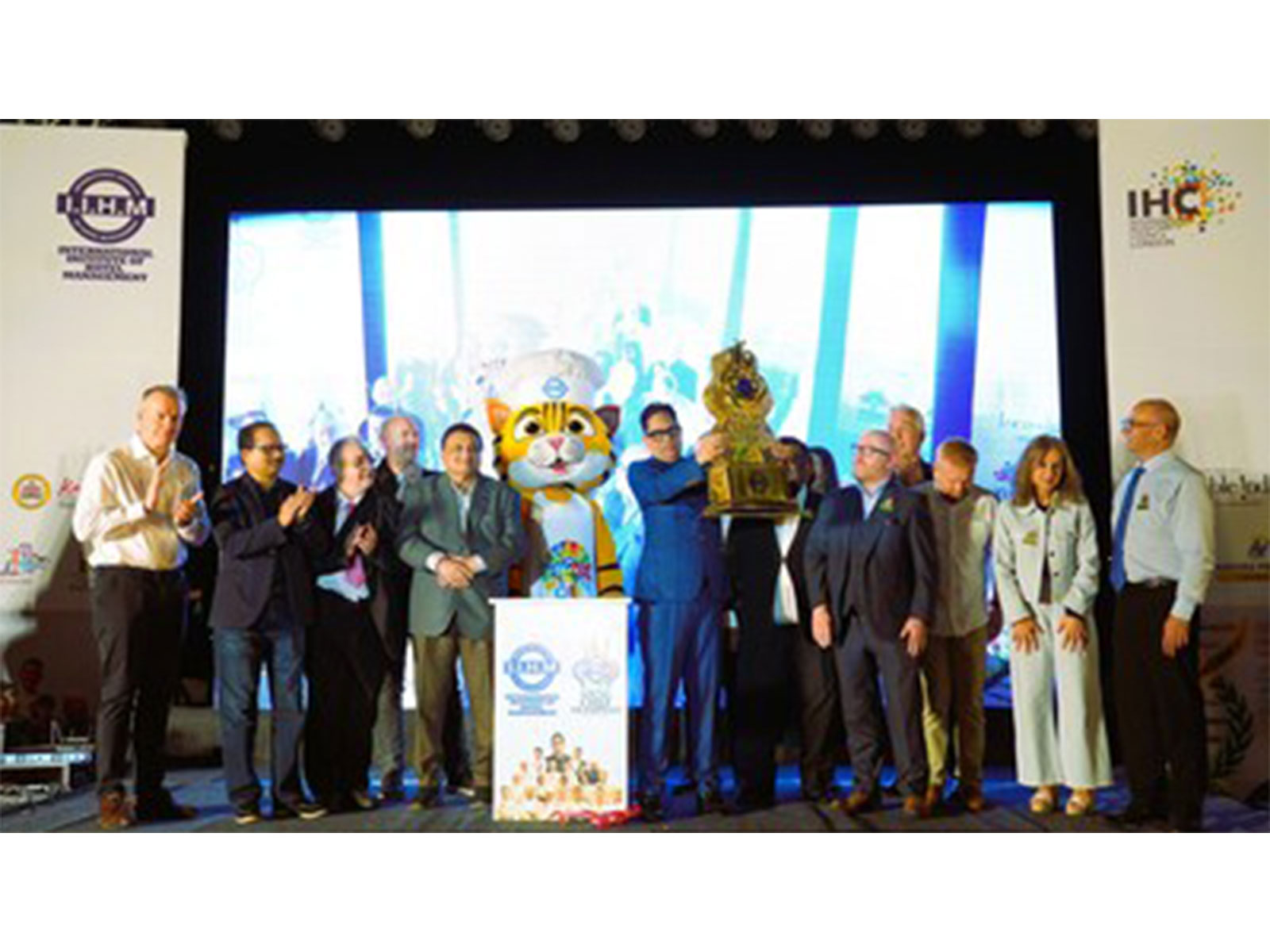 Chairman YCO and IIHM, Dr Suborno Bose unveiling the much awaited trophy of the IIHM International Young Chef Olympiad 2026 accompanied by Top Echelons of the Grand Jury