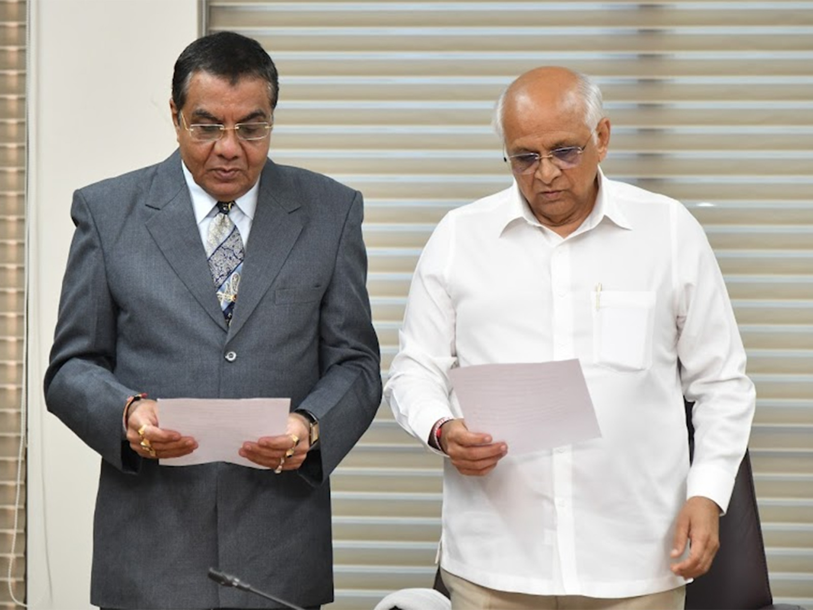CM CM Bhupendra Patel administers oath to Jatin Thakkar (Photo/ Gujarat CMO)