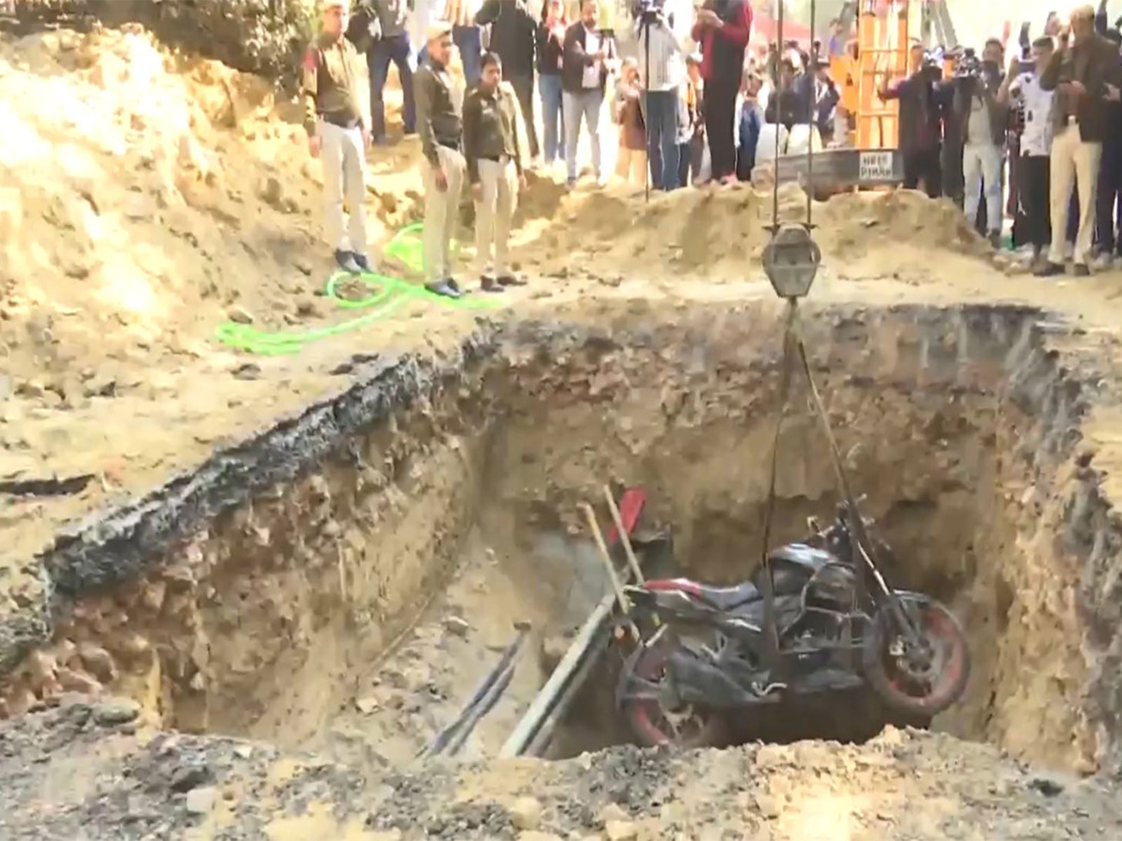 Kamal Dhyani's motorbike recovered from the pit where he fell last night, and succumbed (Photo/ANI)