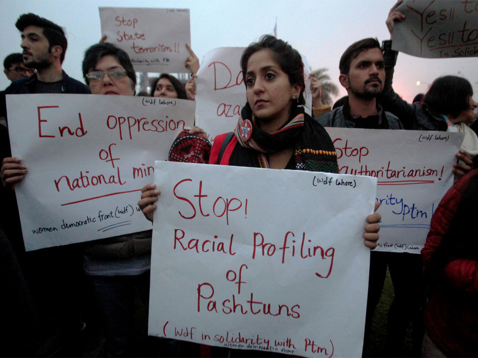 Supporters of Pashtun Tahafuz Movement (PTM) hold signs during a country-wide protests (File Photo/Reuters)