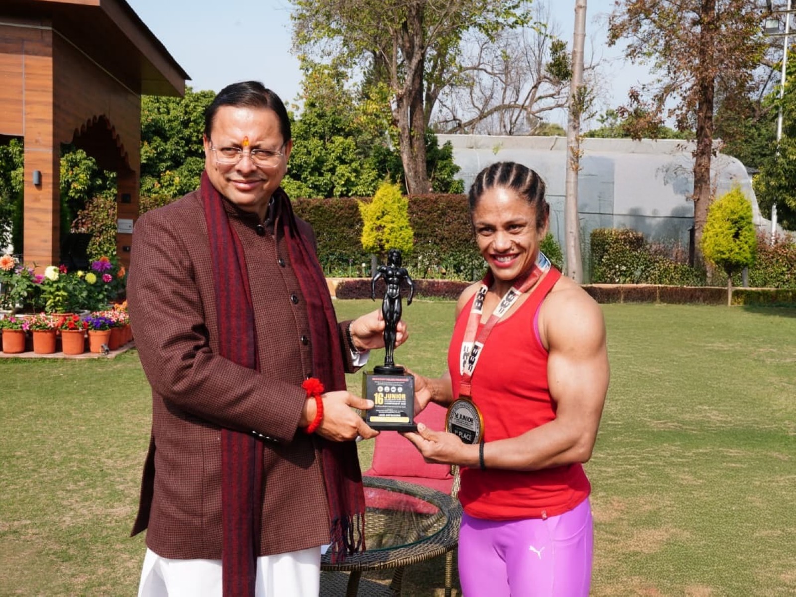 Uttarakhand CM Pushkar Singh Dhami honours with international bodybuilder Pratibha Thapliyal. (Photo/Uttarakhand/CMO)