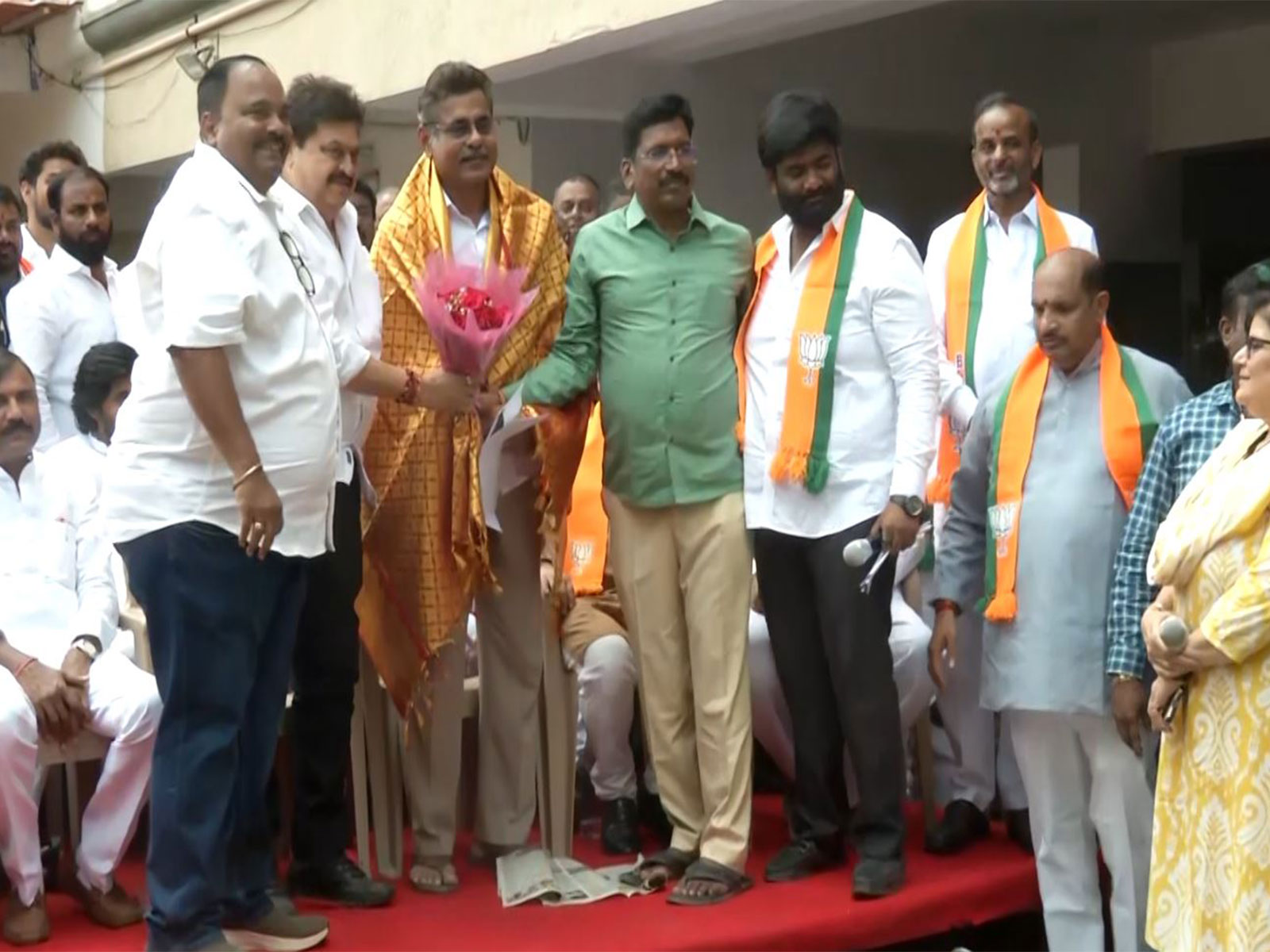 Telangana BJP State President N Ramchander Rao with the residents of Madhu Park Ridge Apartments (Photo/ANI)