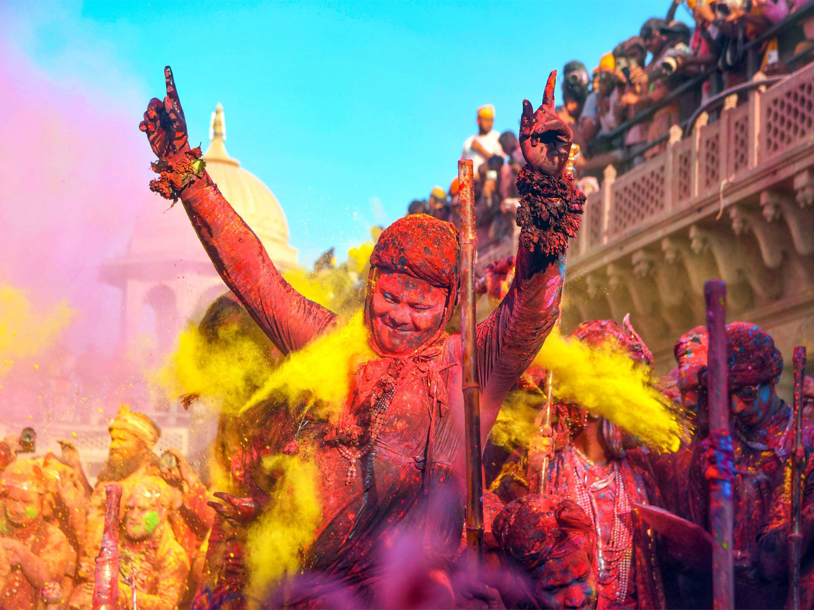 Pilgrims play with colours ahead of the Holi festival (Photo/ANI)