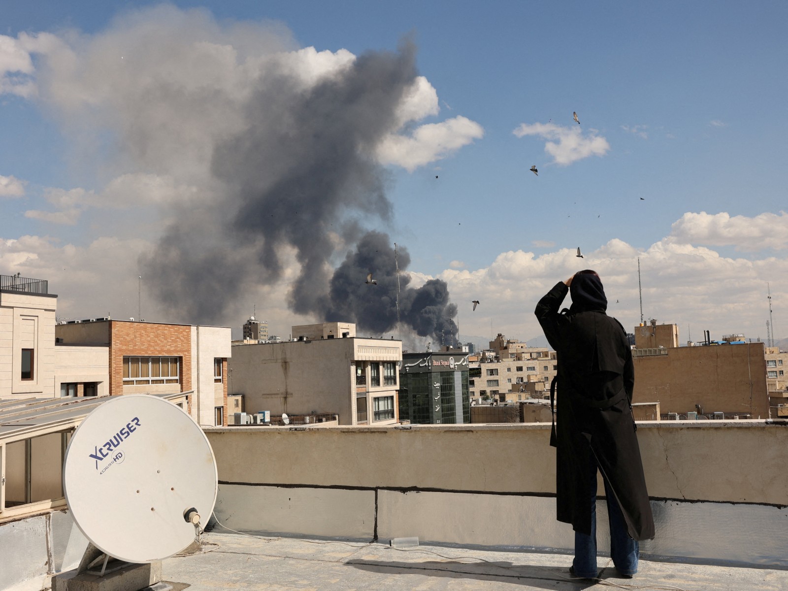 Smoke rises following an explosion, after Israel and the U.S. launched strikes on Iran (Photo/Reuters)