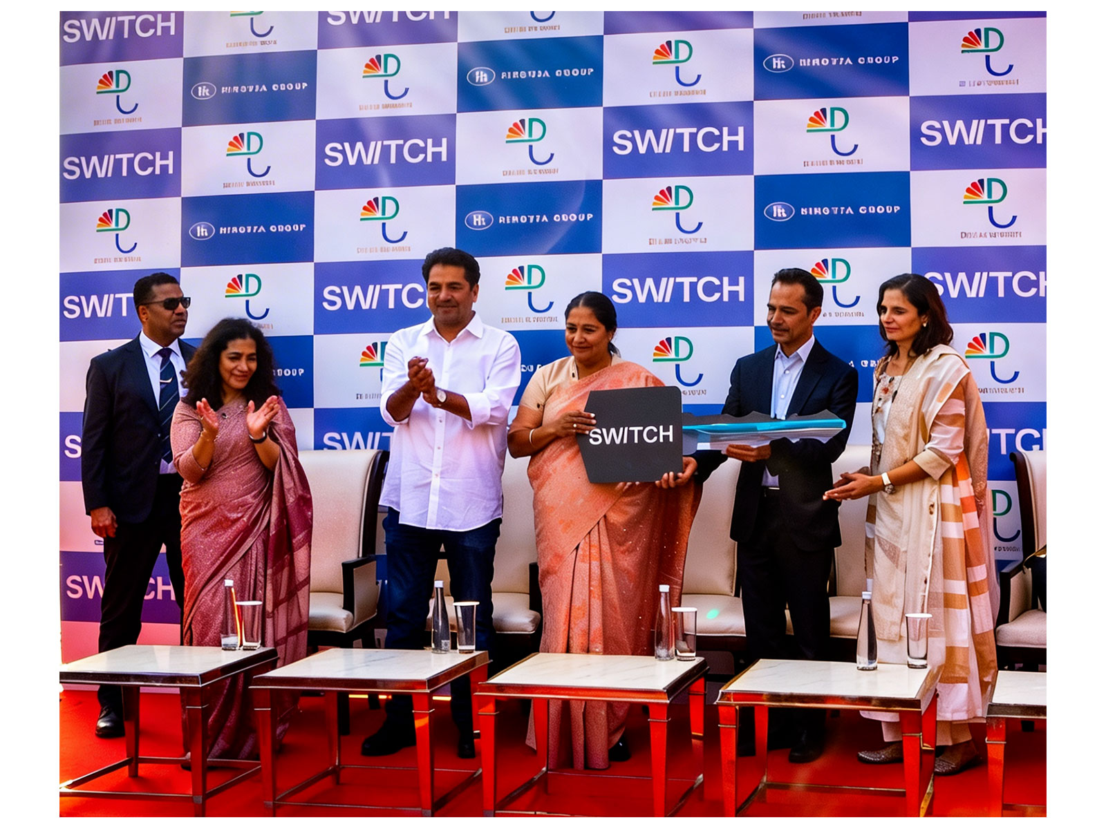 Delhi CM Rekha Gupta ( Center ), Tourism minister Kapil Mishra (Left) Mr Dheeraj Hinduja Chairman of Ashok Leyland (Right) in the presence of his wife Shalini Hinduja (Extreme Right) Delhi CM Rekha Gupta ( Center ), Tourism minister Kapil Mishra (Left) Mr Dheeraj Hinduja Chairman of Ashok Leyland (Right) in the presence of his wife Shalini Hinduja (Extreme Right)