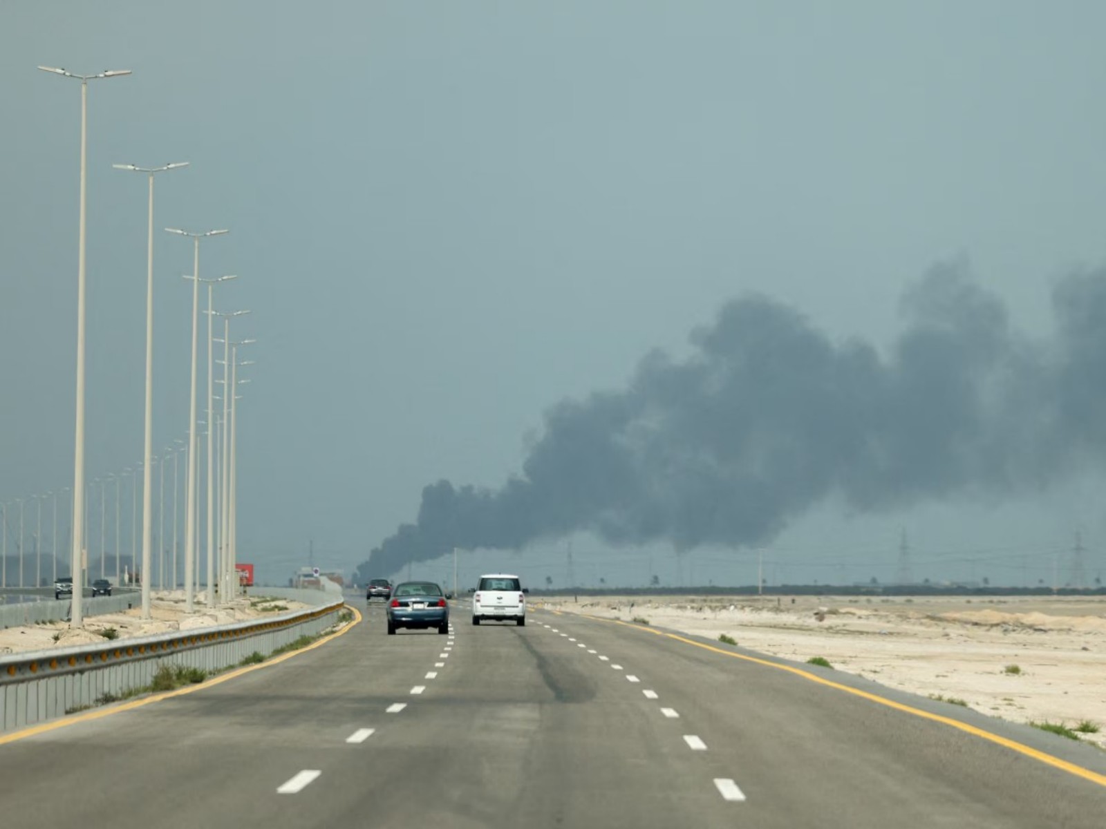 Vehicles move along a road as smoke billows from Saudi Aramco's Ras Tanura oil refinery after a reported Iranian drone strike, amid the U.S.-Israel conflict with Iran, in Ras Tanura, Saudi Arabia (Photo/Reuters) Vehicles move along a road as smoke billows from Saudi Aramco's Ras Tanura oil refinery after a reported Iranian drone strike, amid the U.S.-Israel conflict with Iran, in Ras Tanura, Saudi Arabia (Photo/Reuters)