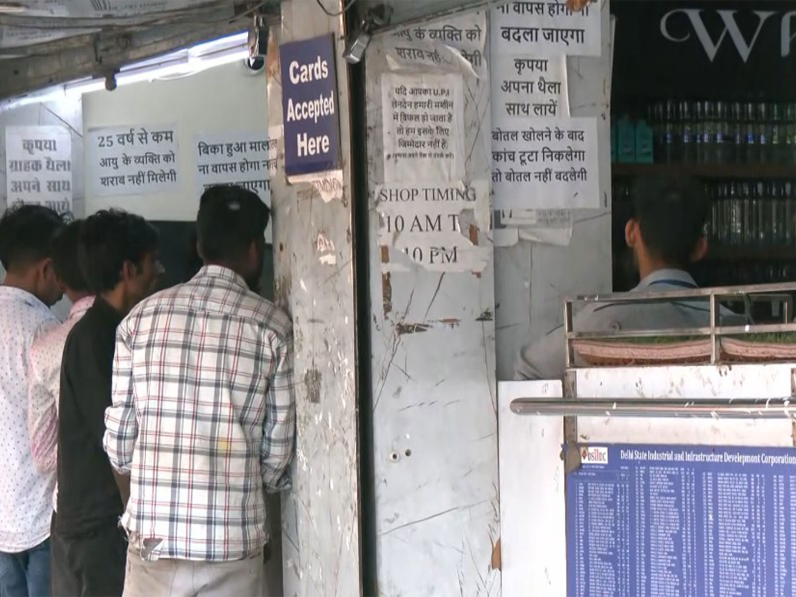 People outside a liquor shop in Delhi on Holi (Photo/ANI)