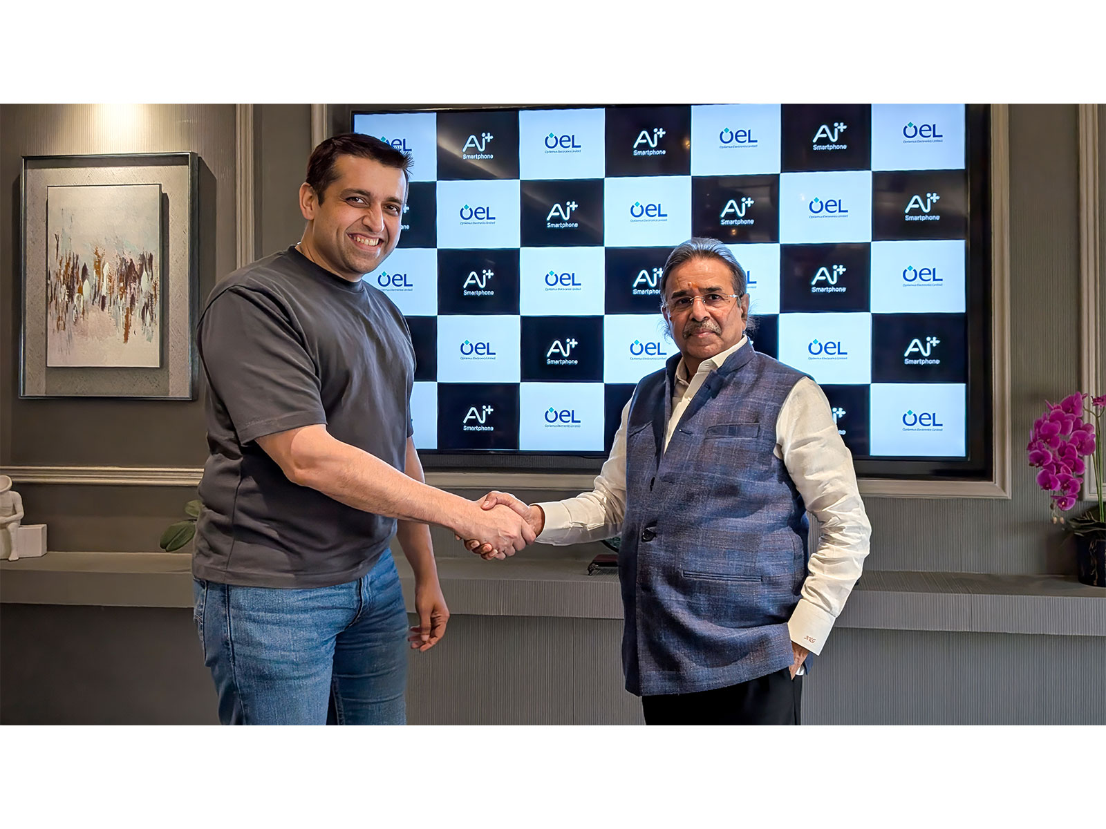 Left to Right - Madhav Sheth, CEO, Ai+ Smartphone and Founder, NxtQuantum Shift Technologies with Ashok Gupta, Director, Optiemus Electronics Limited