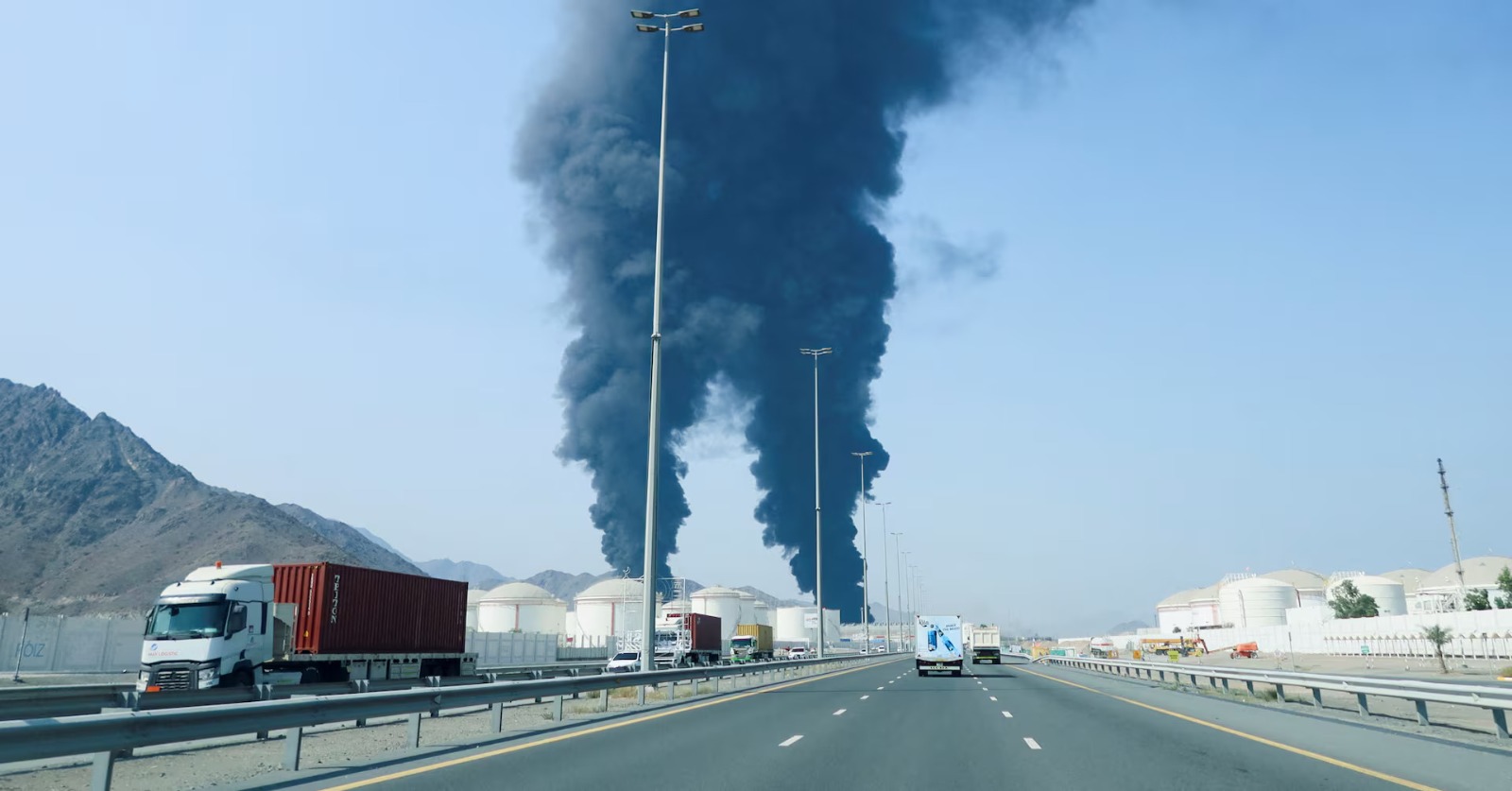 Smoke rises from the Fujairah Oil Industry Zone after debris from an intercepted drone fell in the area (Photo/Reuters)