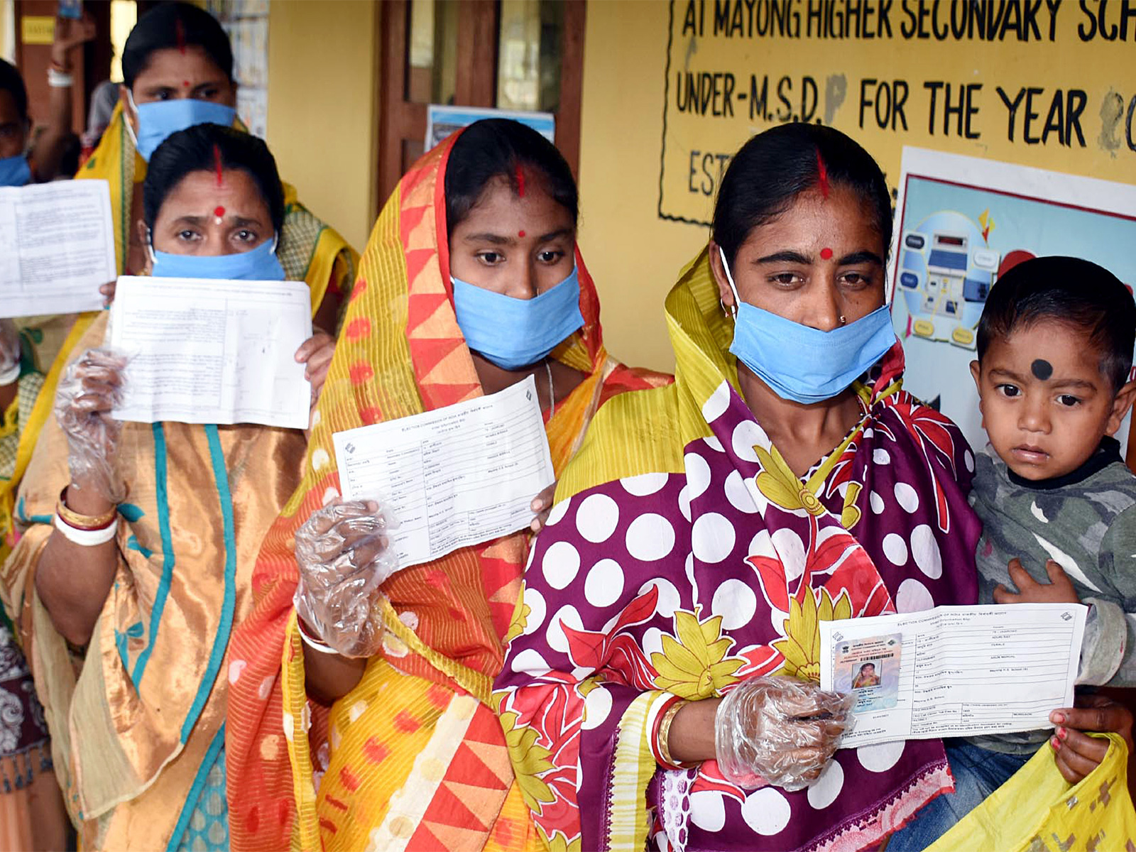 A file photo of people queuing up outside a polling station during 2021 ssembly polls in Assam. (Photo/ANI) A file photo of people queuing up outside a polling station during 2021 ssembly polls in Assam. (Photo/ANI)