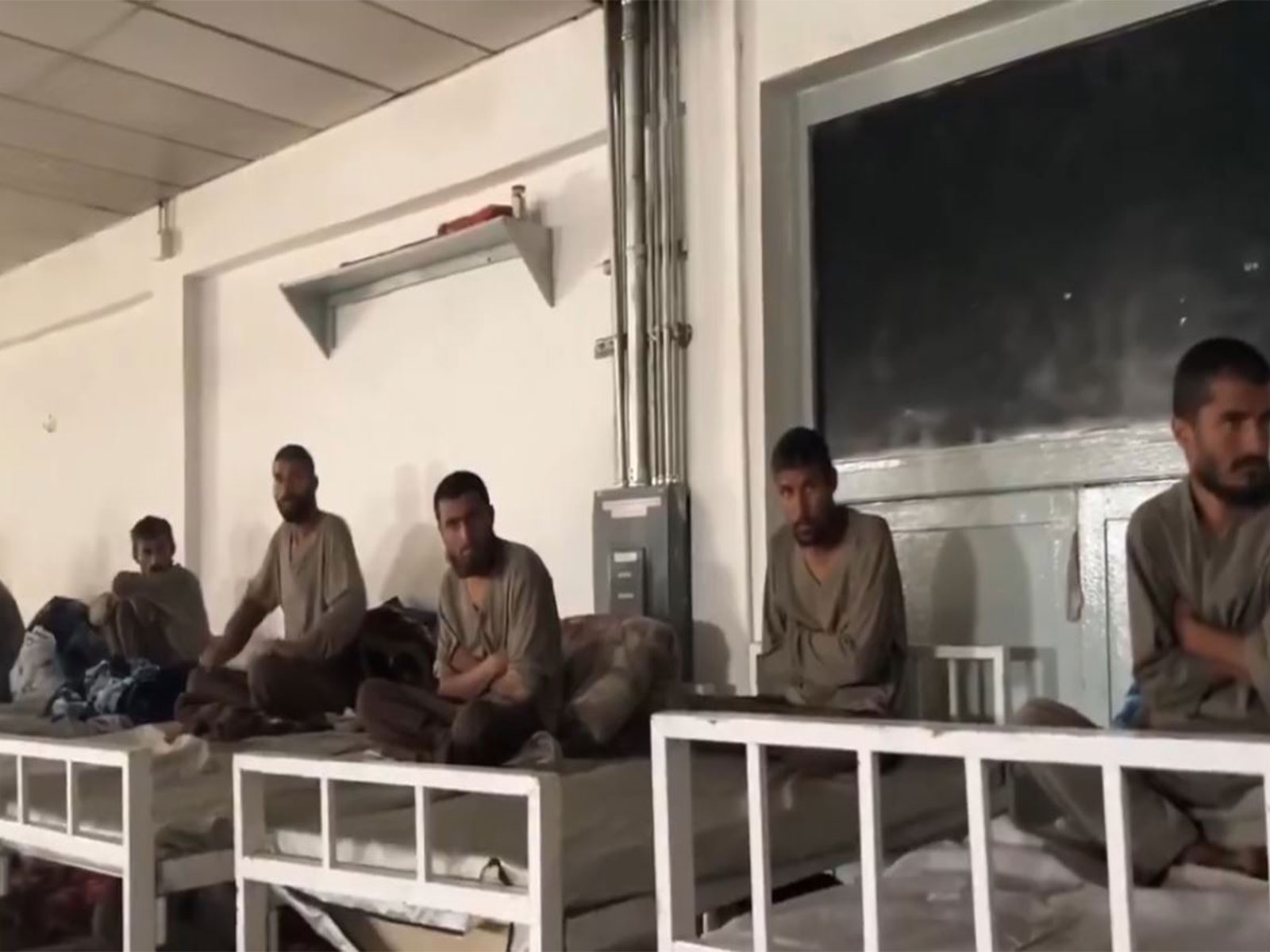 Afghan Taliban members in a holding area or shelter amidst escalating tensions between Pakistan and Afghanistan (Photo: x/@IHRF_English)