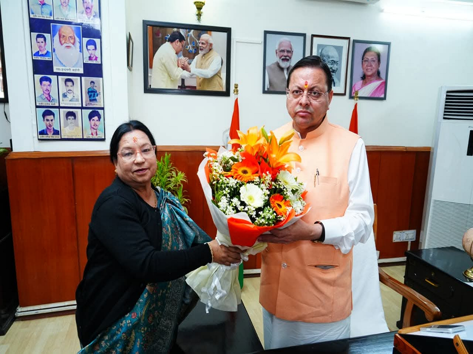 Uttarakhand Chief Minister Pushkar Singh Dhami with BJP MLA Parvati Das (Photo/ANI)