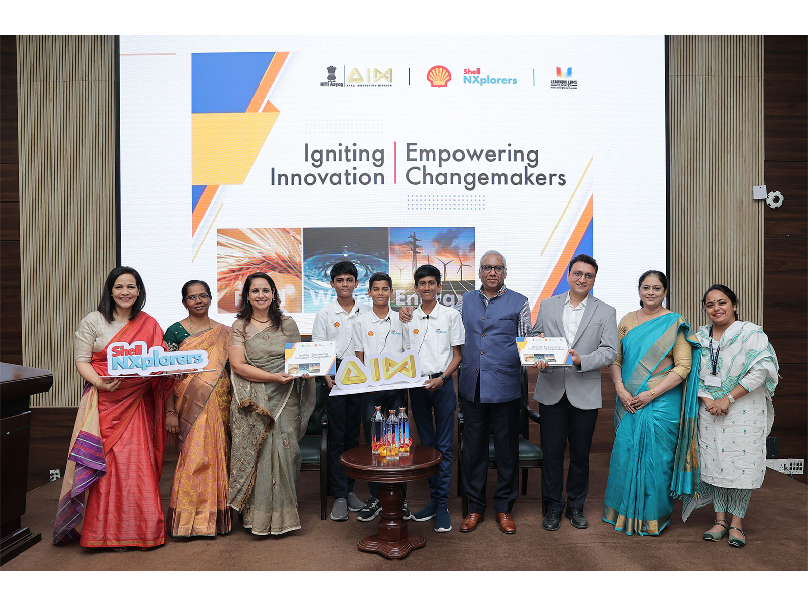 Officials from AIM, NITI Aayog, Shell India, and LLF, along with students and ATL Coordinator, at the unveiling of the NXplorers Coffee Table Book Officials from AIM, NITI Aayog, Shell India, and LLF, along with students and ATL Coordinator, at the unveiling of the NXplorers Coffee Table Book