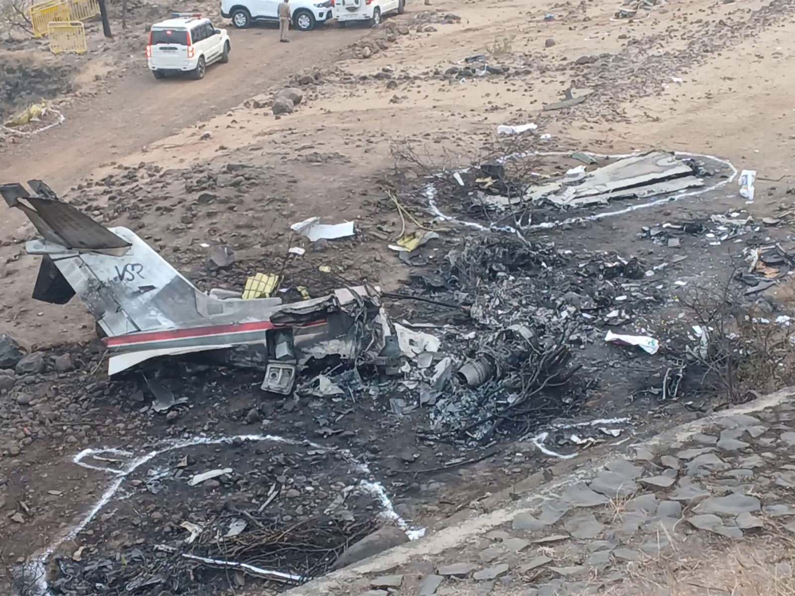 Charred remains of the charter plane at the crash site, in which Maharashtra Deputy Chief Minister Ajit Pawar lost his life (File Photo/ANI)