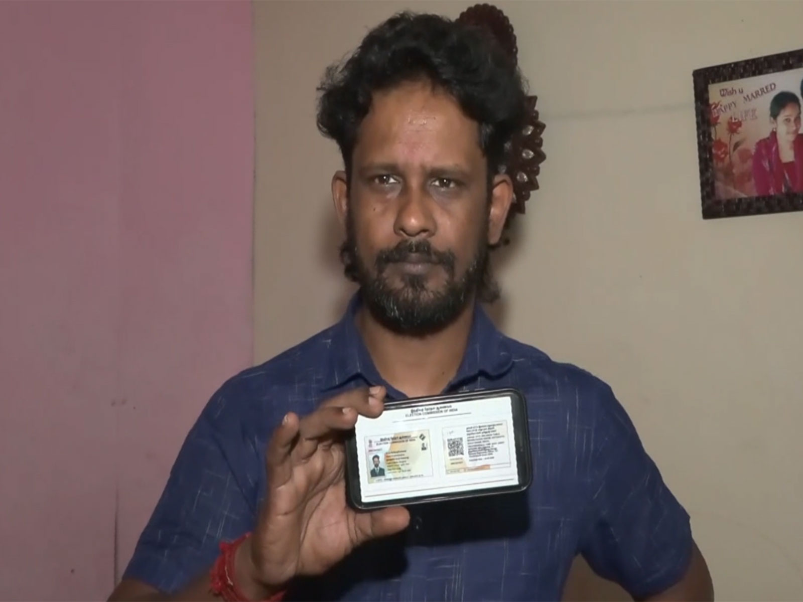 Gokuleswaran, a resident of Sri Lankan Tamils Rehabilitation Camp in Tiruchipalli shows his new voter ID (Photo/ANI) Gokuleswaran, a resident of Sri Lankan Tamils Rehabilitation Camp in Tiruchipalli shows his new voter ID (Photo/ANI)