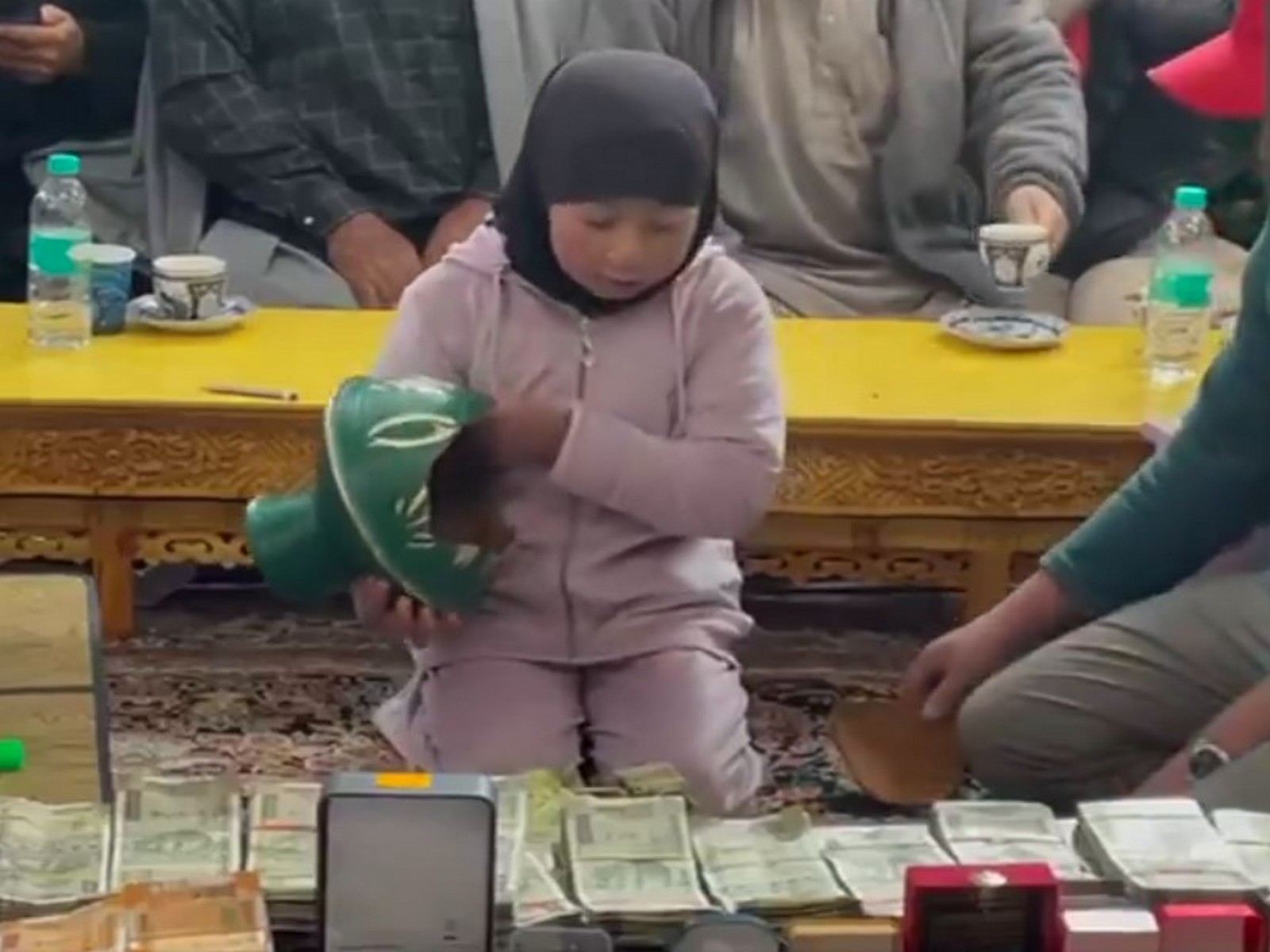 Little girl breaks piggy bank to donate for Iran (Photo/ANI)