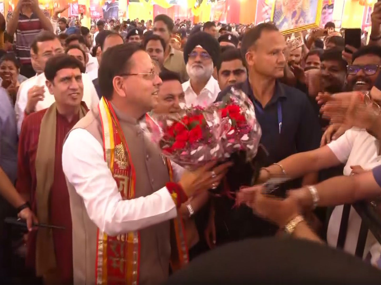 People greet Uttarakhand CM Pushkar Singh Dhami (Photo/ANI)