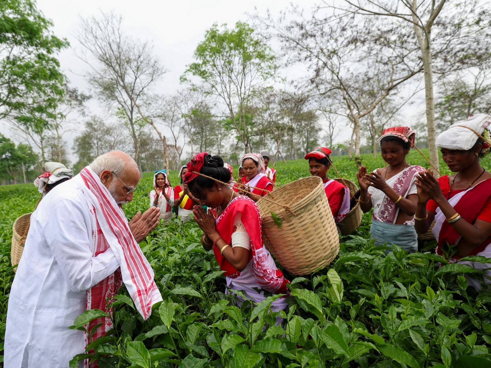 Prime Minister Narendra Modi visited a tea garden in Dibrugarh on Wednesday morning and interacted with the women working here. (Photo/ANI)