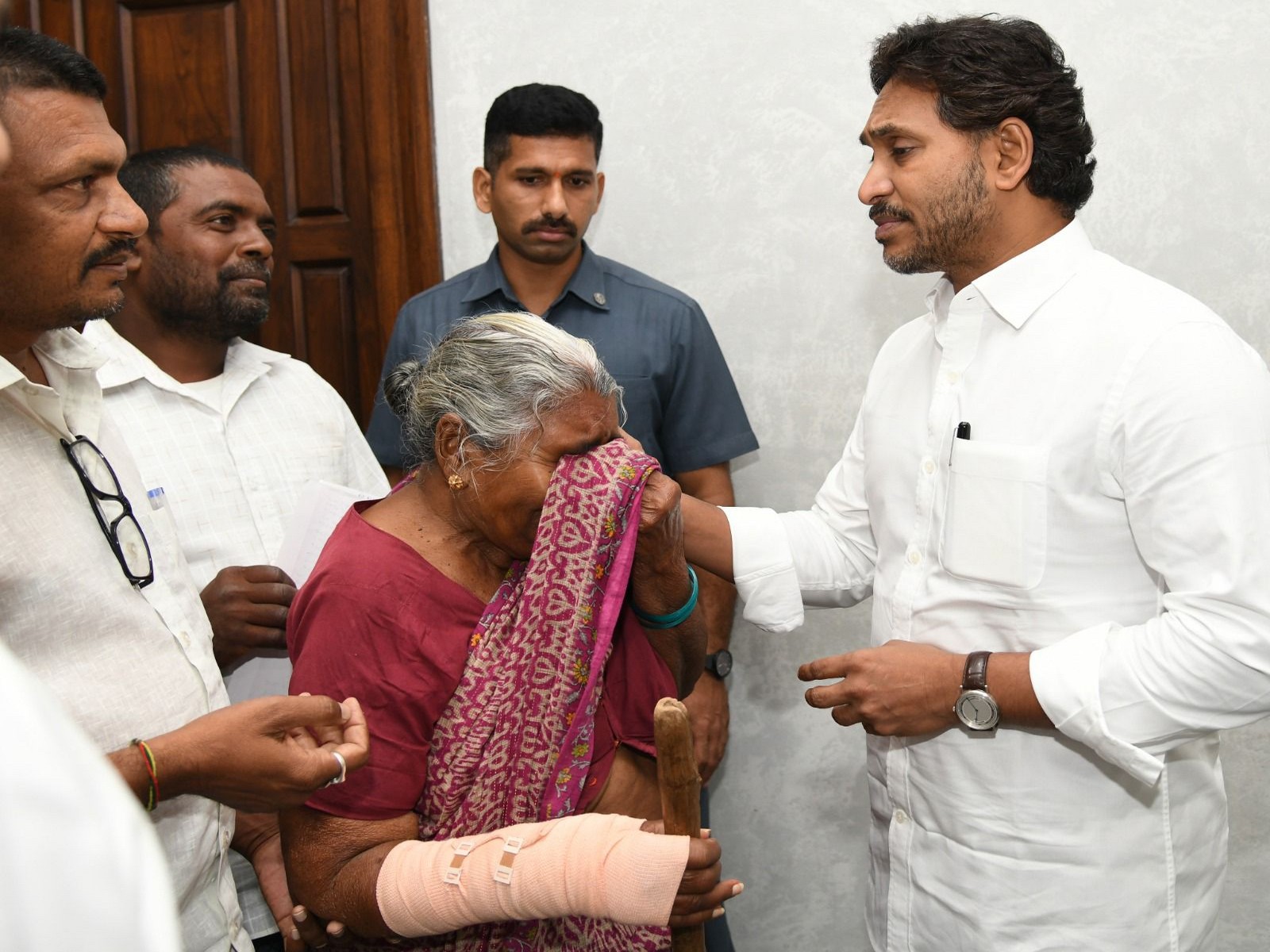 YS Reddy meets 90-year-old woman alleging land grab (Photo/ANI) YS Reddy meets 90-year-old woman alleging land grab (Photo/ANI)