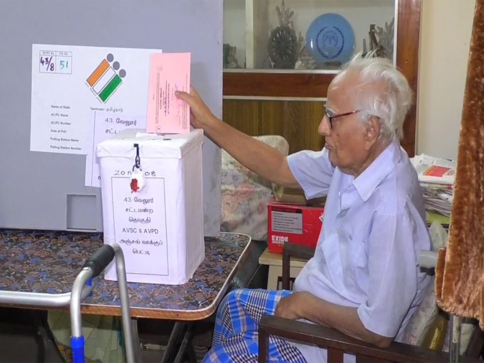 A senior citizen in Tamil Nadu casting his vote from home via a postal ballot box (Photo/ANI) A senior citizen in Tamil Nadu casting his vote from home via a postal ballot box (Photo/ANI)