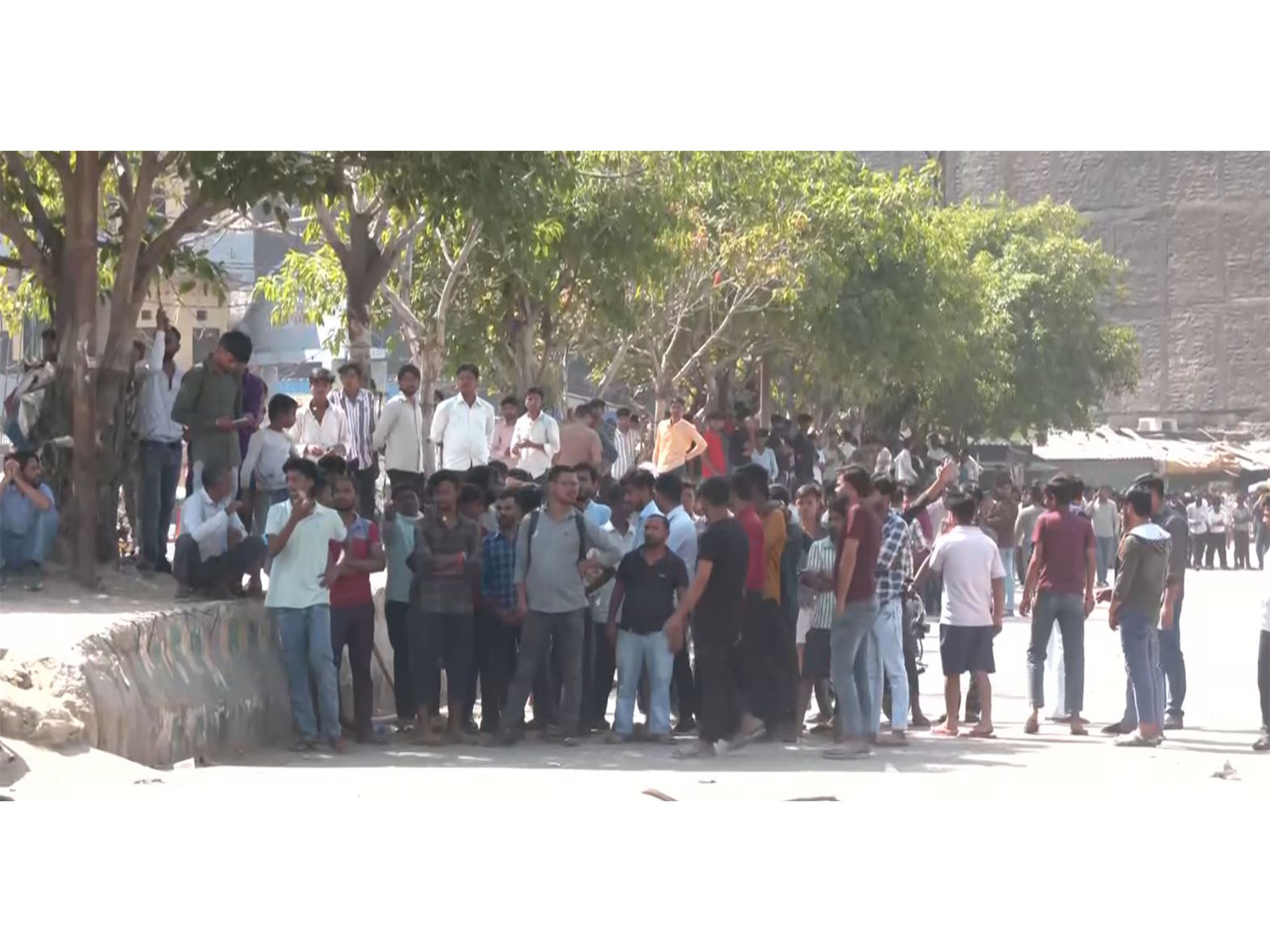 Workers protest in Noida (Photo/ANI)