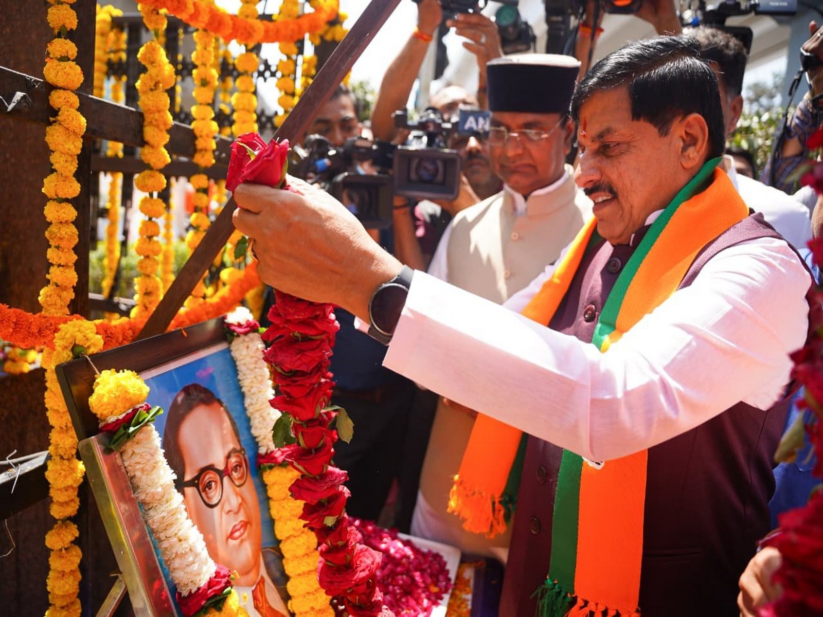 MP CM Mohan Yadav is paying floral tribute to Dr BR Ambedkar (Photo / X @CMMadhyaPradesh)