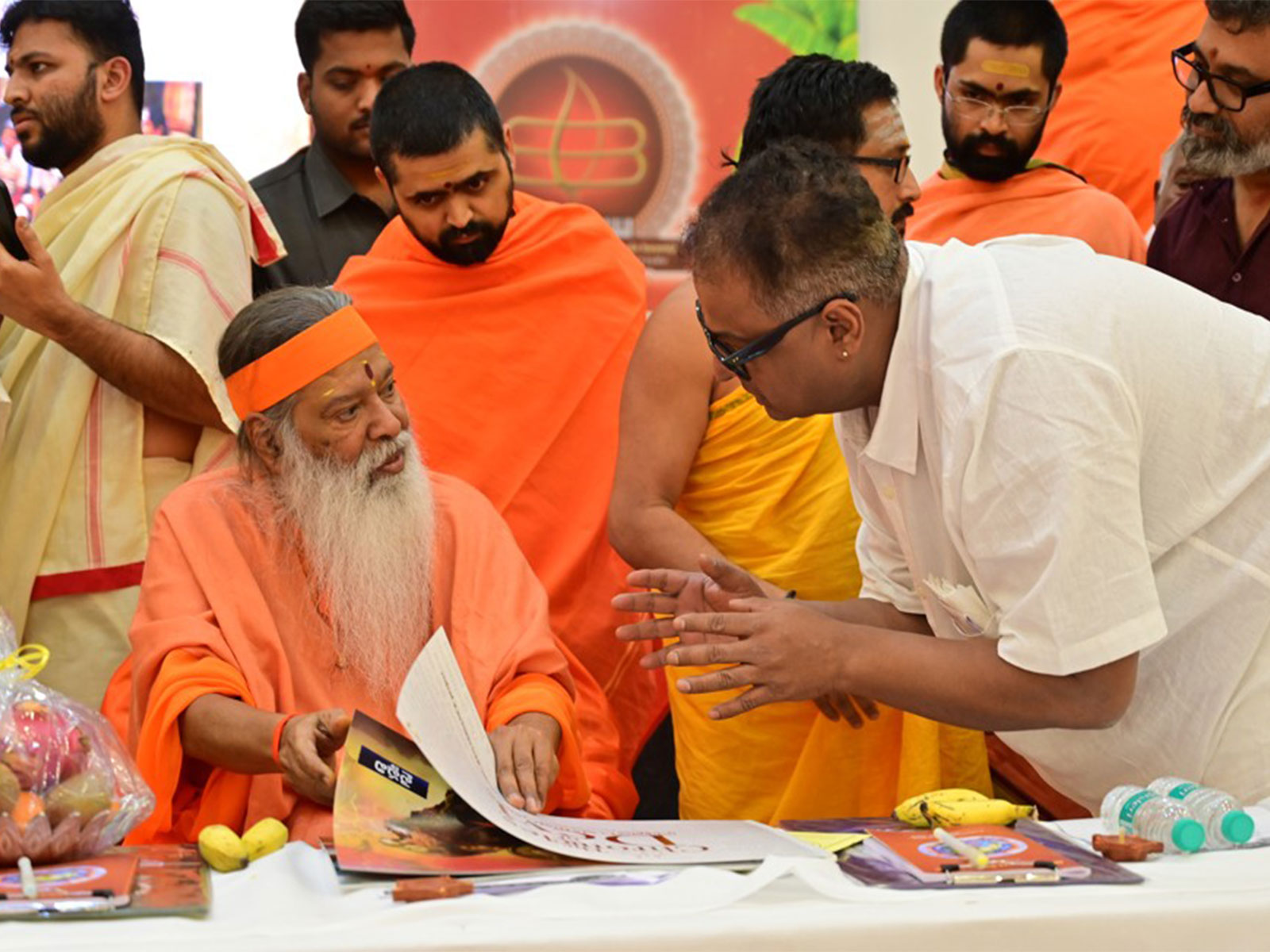 Director Manu Kumaran presenting the Chronicles of Devi brochure to Avadhoota Datta Peethadhipati Jagadguru Sri Sri Sri Ganapathy Sachchidananda Swamiji (Photo/ Manu Kumaran/Mediente Films)