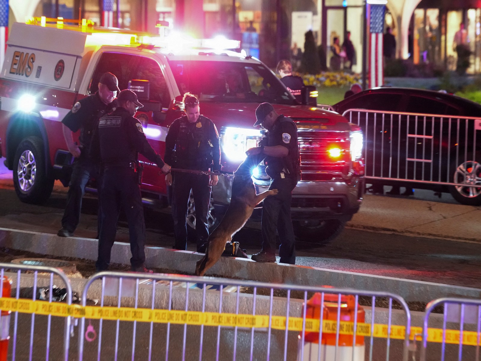 A police K-9 Unit officer stands with other law enforcement personnel at the venue following a shooting incident during the annual White House Correspondents' Association dinner, in Washington (Photo/ Reuters) A police K-9 Unit officer stands with other law enforcement personnel at the venue following a shooting incident during the annual White House Correspondents' Association dinner, in Washington (Photo/ Reuters)