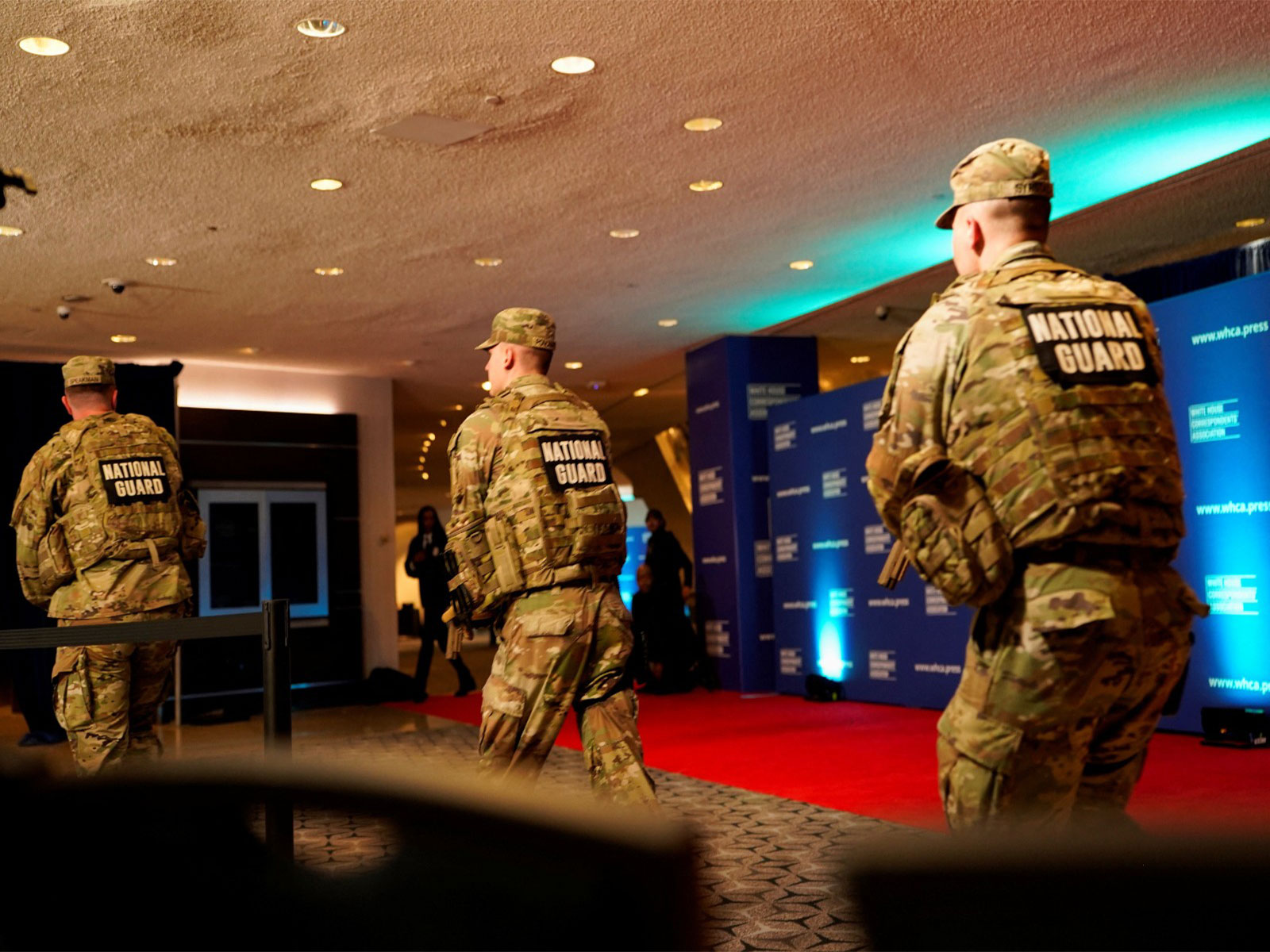 Members of the National Guard rush next to the red carpet of the annual White House Correspondents’ Association dinner after a reported shooting incident in Washington DC (Photo/ Reuters) Members of the National Guard rush next to the red carpet of the annual White House Correspondents’ Association dinner after a reported shooting incident in Washington DC (Photo/ Reuters)