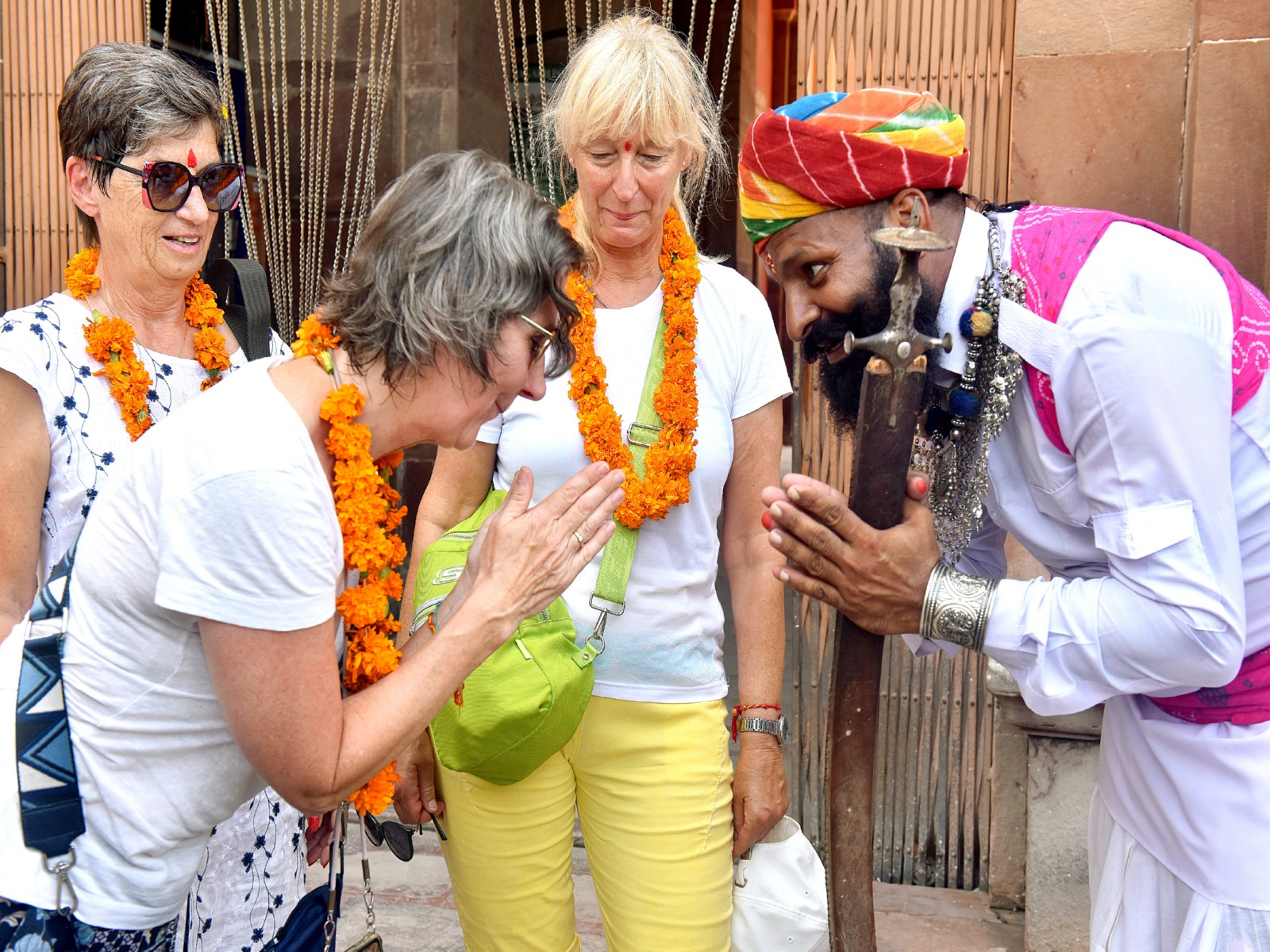 A Rajasthani folk artist welcoming a tourist (Photo-ANI) A Rajasthani folk artist welcoming a tourist (Photo-ANI)