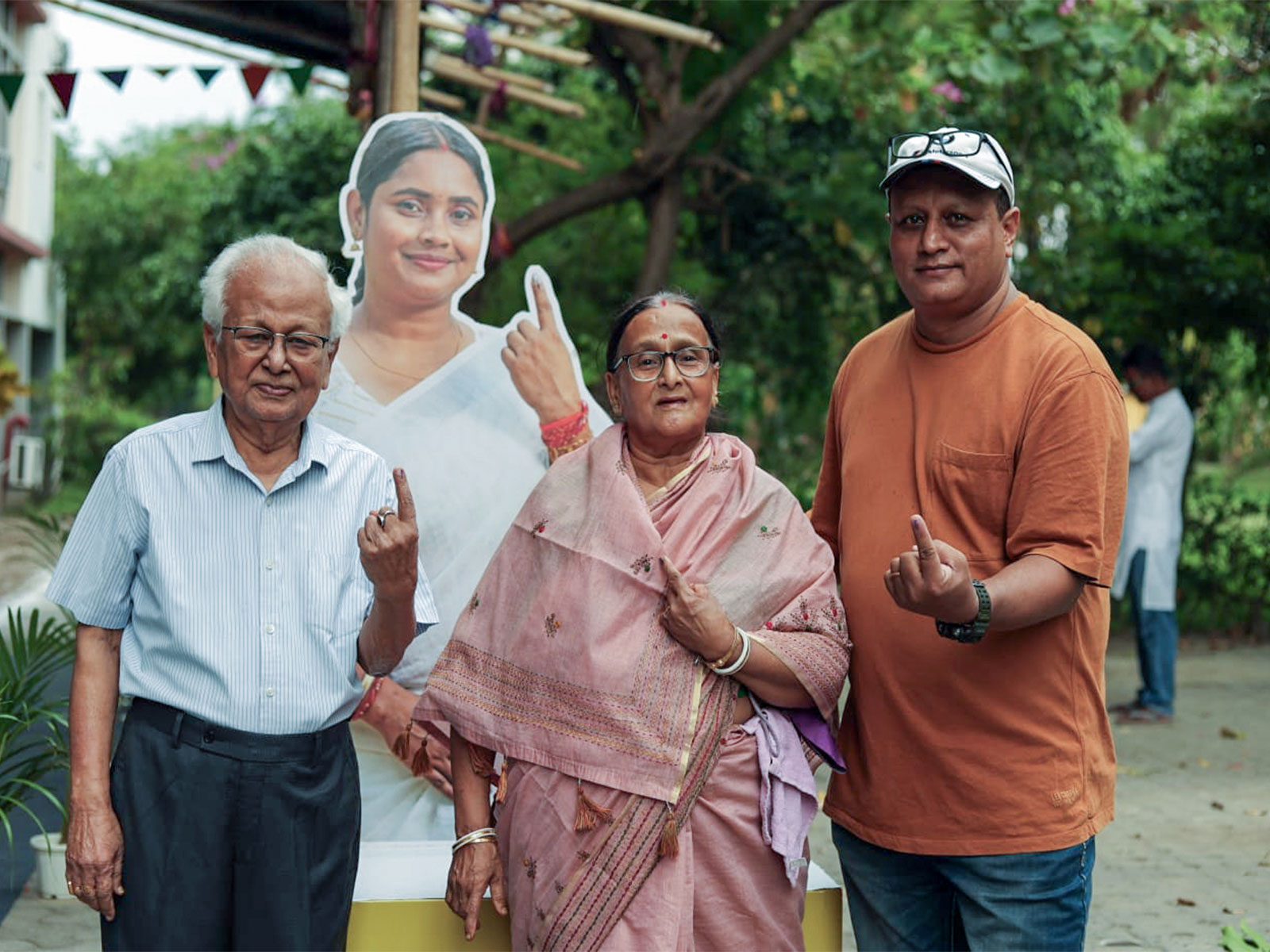 People show inked fingers after casting votes in second phase West Bengal assembly polls (Photo/ANI)