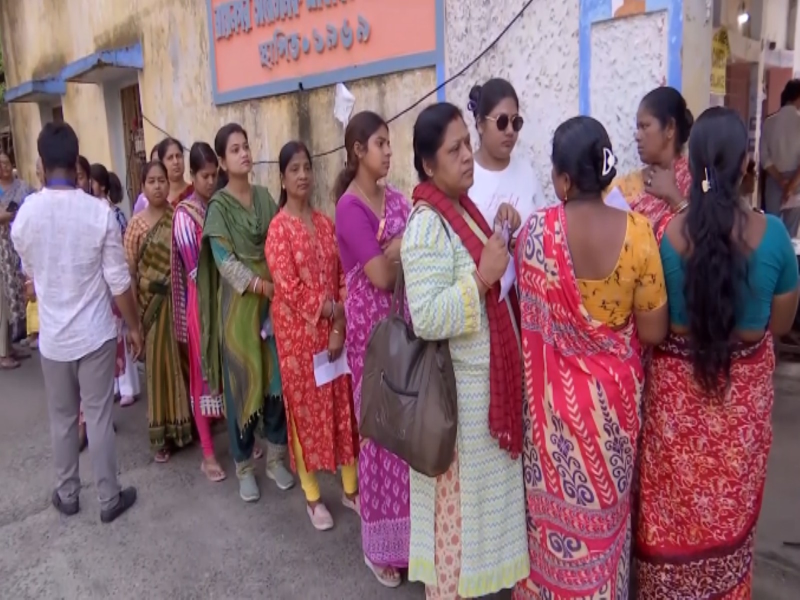Voters standing in long queues at one of the polling station in South 24 Parganas (Photo/ANI)