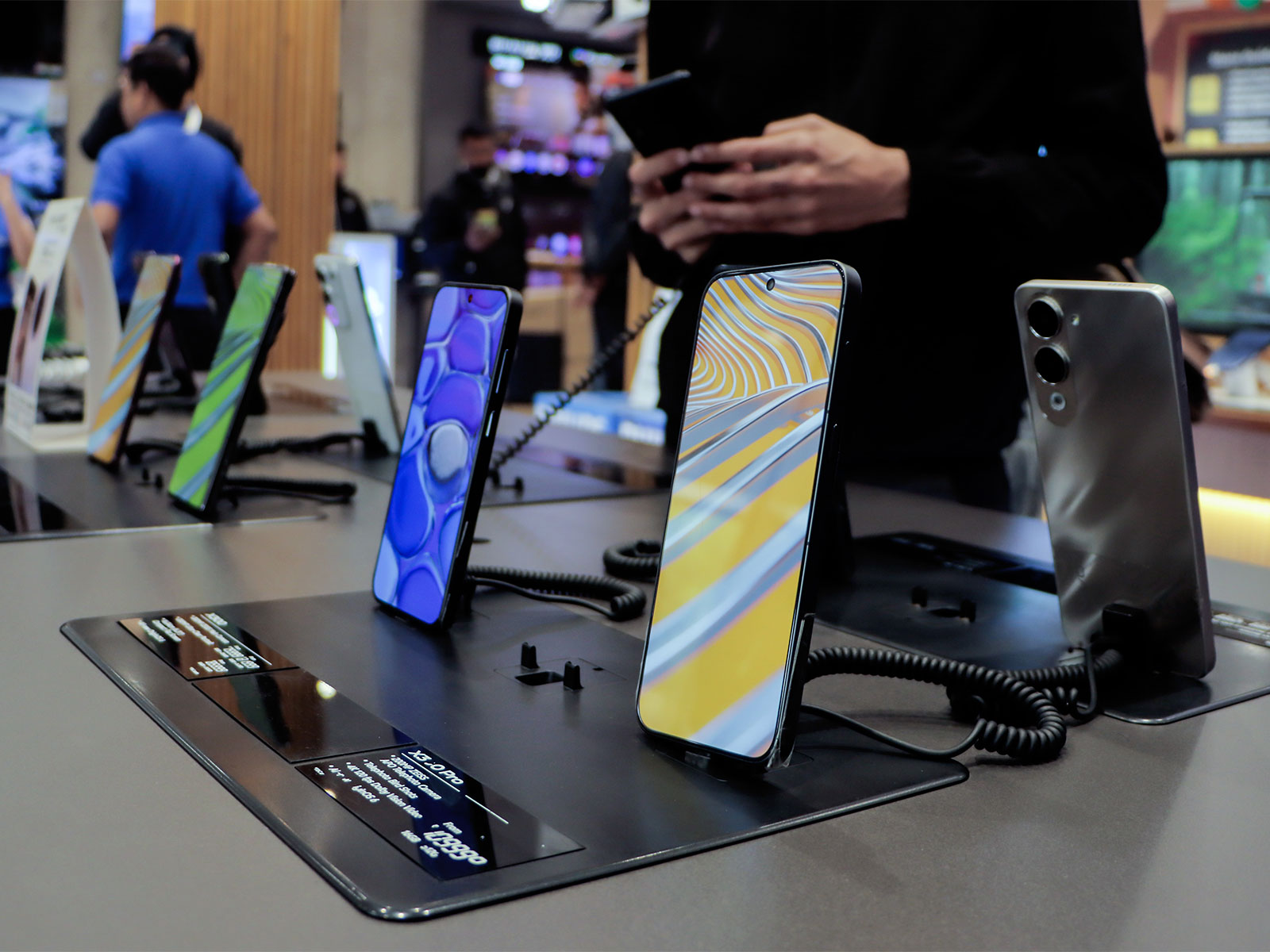Smartphones are on display at a showroom (Photo/ANI) Smartphones are on display at a showroom (Photo/ANI)