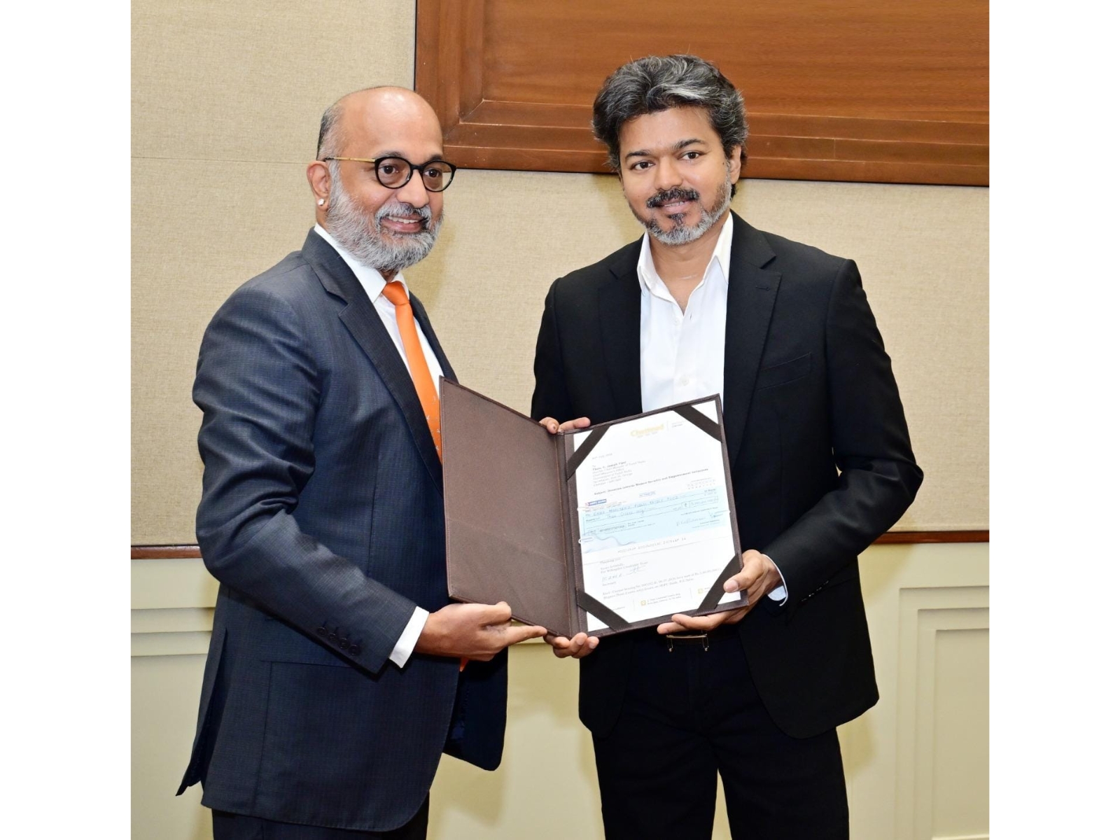 Chief Minister C. Joseph Vijay receiving the cheque from Chettinad Group managing director M.A.M.R. Muthiah at the Secretariat on Monday Chief Minister C. Joseph Vijay receiving the cheque from Chettinad Group managing director M.A.M.R. Muthiah at the Secretariat on Monday