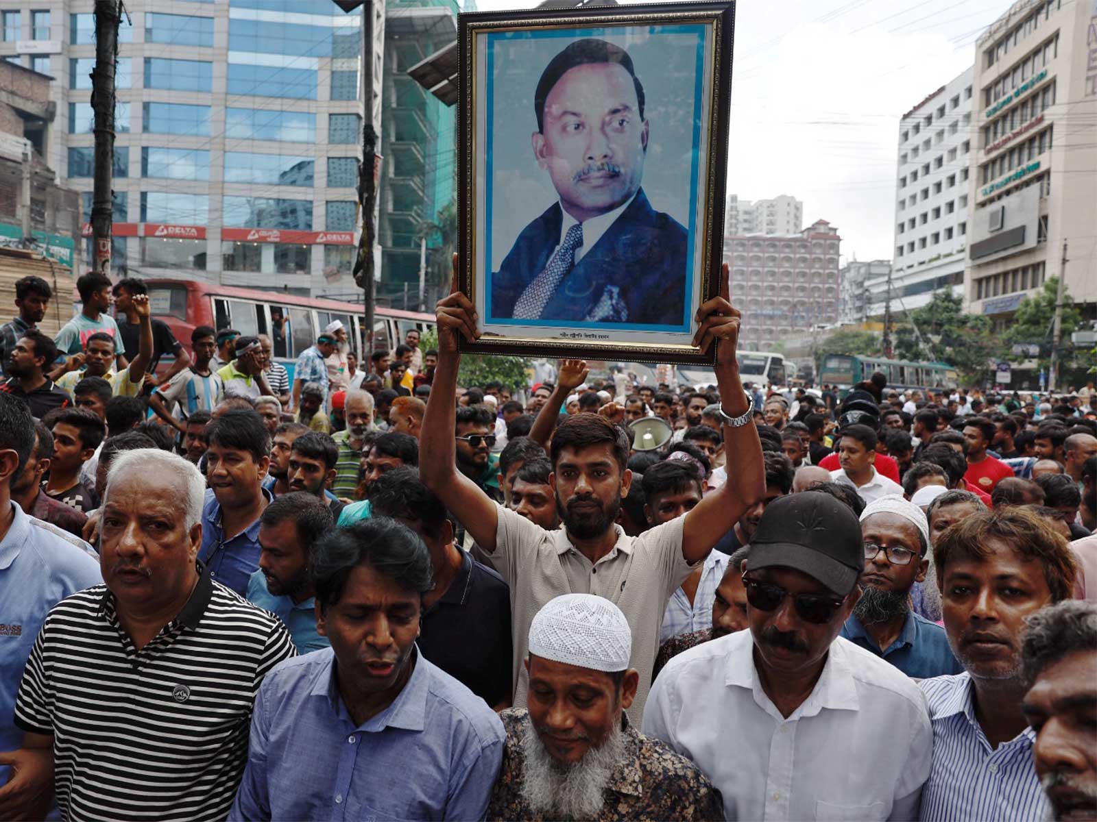 Supporter of Bangladesh Nationalist Party (BNP) holds a picture of former President Ziaur Rahman (File Photo/Reuters) Supporter of Bangladesh Nationalist Party (BNP) holds a picture of former President Ziaur Rahman (File Photo/Reuters)