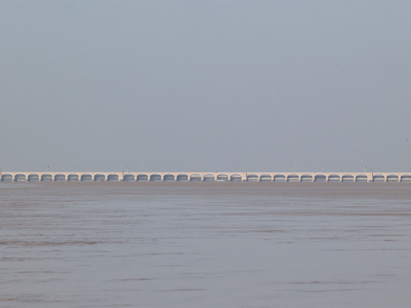 Flood water passes through a barrage in Pakistan (File Photo/Reuters) Flood water passes through a barrage in Pakistan (File Photo/Reuters)
